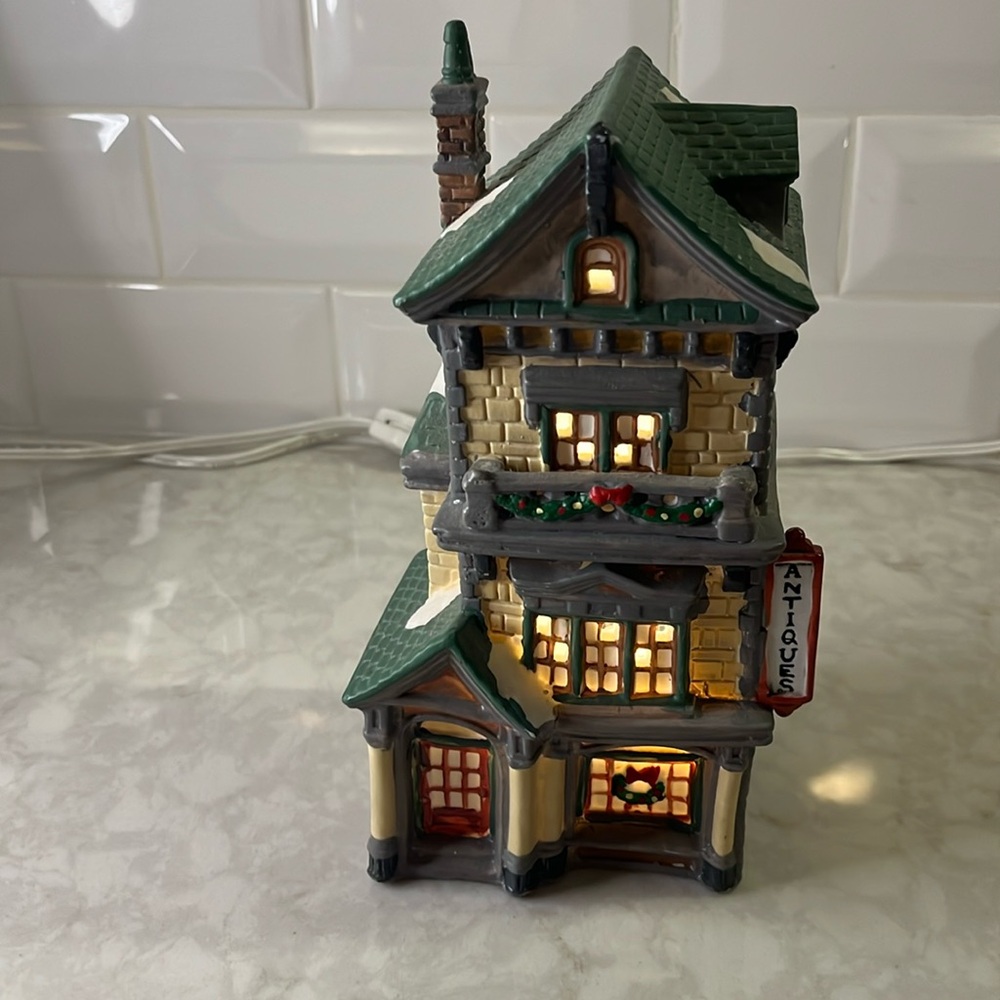 Dickens Collectables 1994  Porcelain Lighted Antiques Shop. 8.5” tall 4” wide